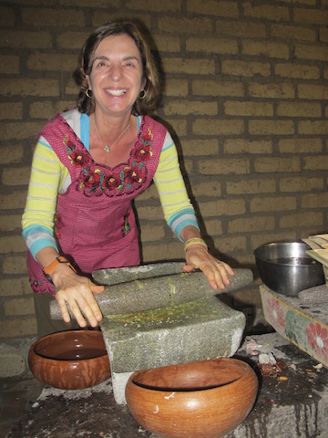 In Oaxaca - making mole... no electricity, surrounded by chickens running around ... but we make the MOST delicious food!